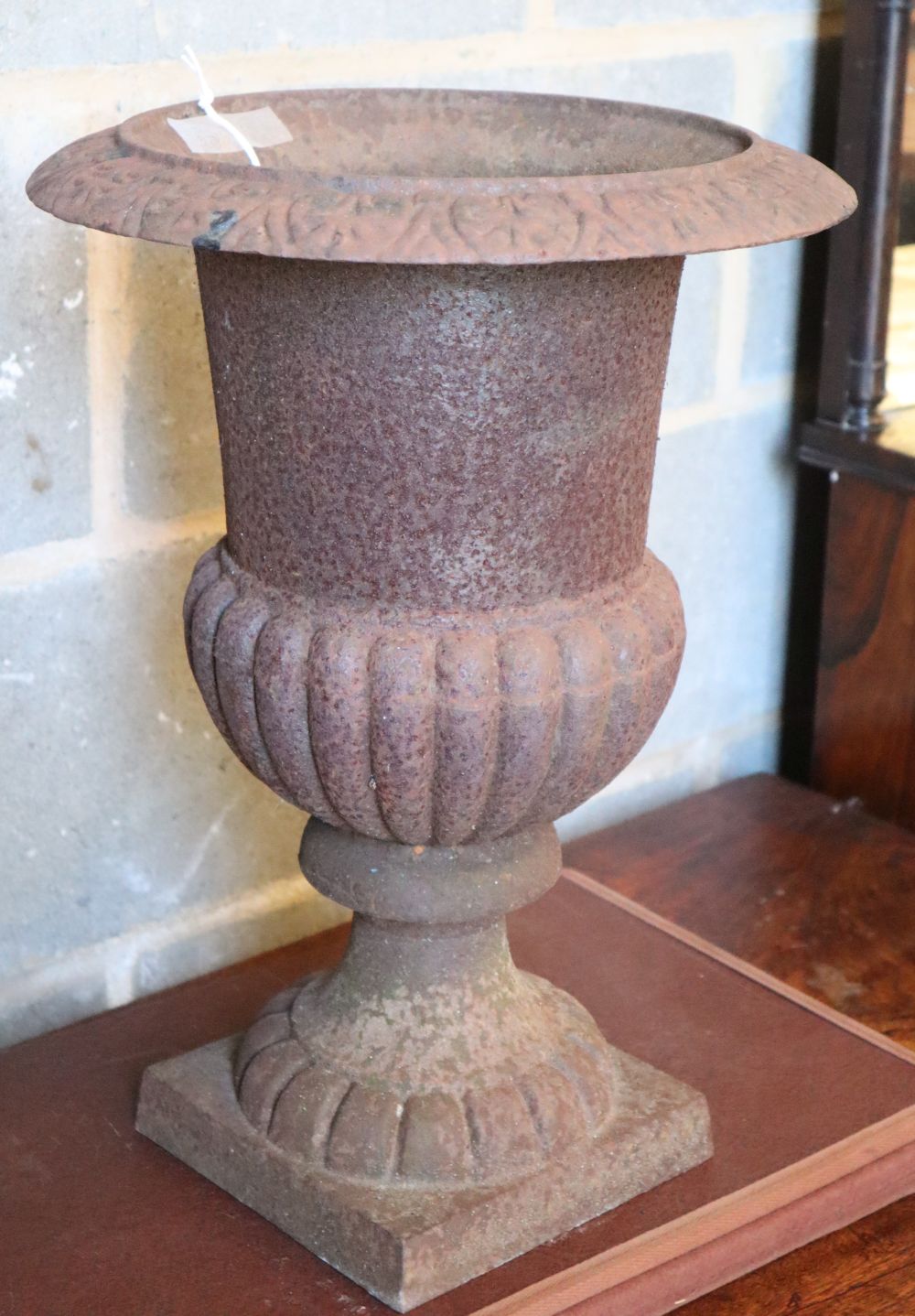 A cast iron campana garden urn, 32cm diameter, H.44cm